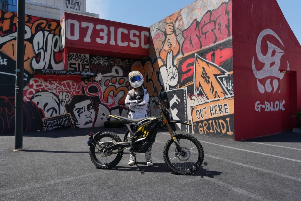 Rider on a Light Bee 2 L3 on a city street